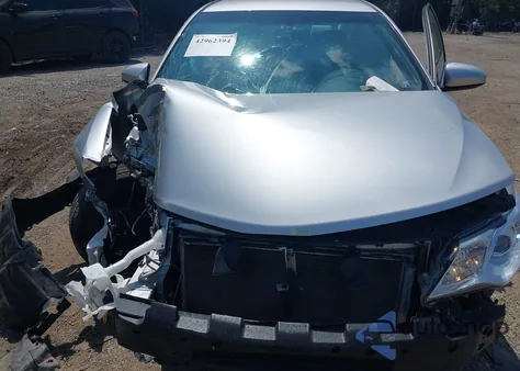 2014 Toyota Camry Le z USA, uszkodzony, nr VIN 4T4BF1FK9ER417320